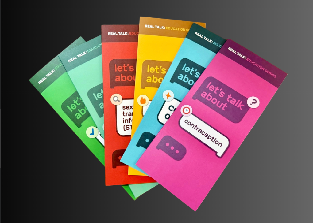 Set of colorful brochures on a dark background